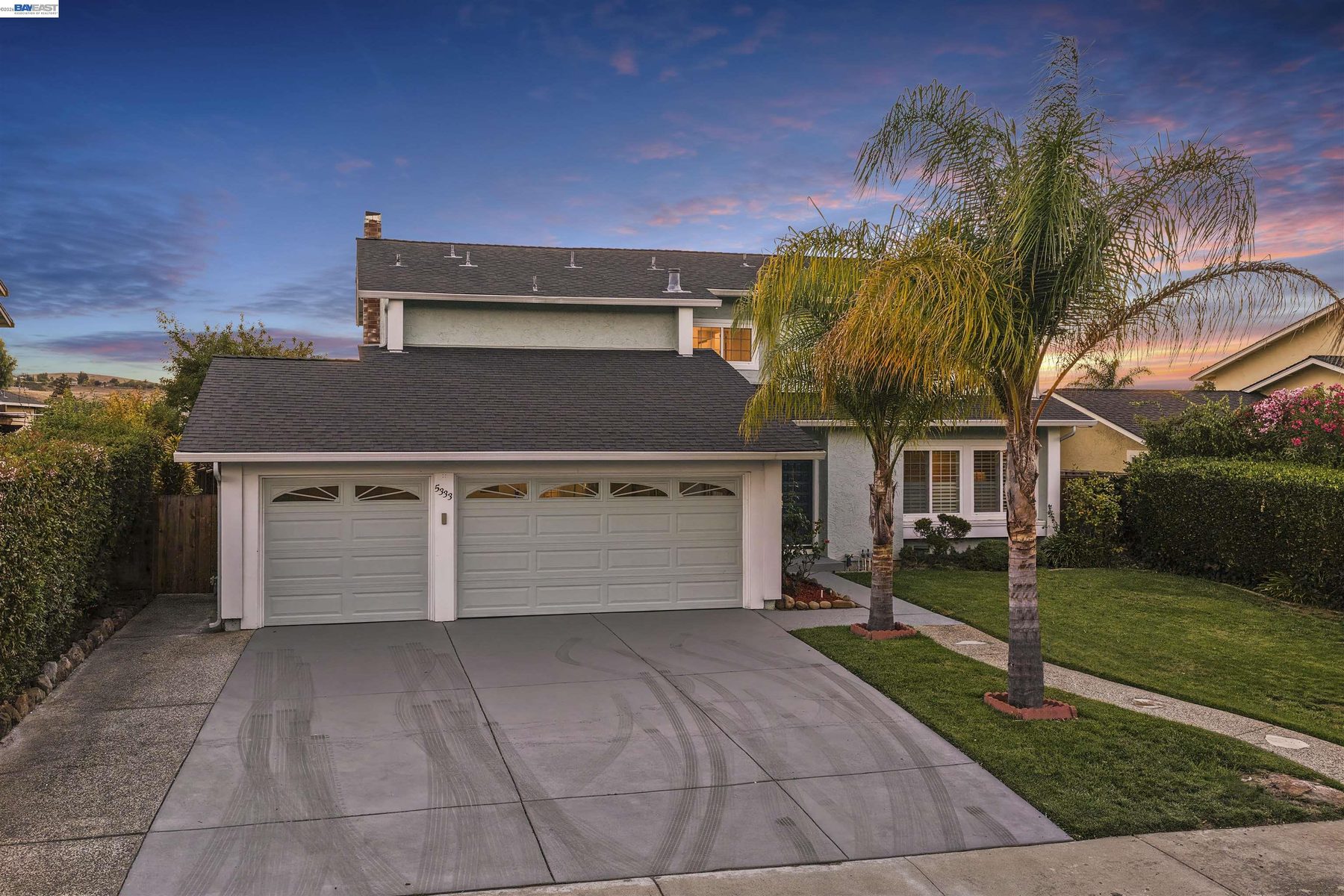 Front elevation of the home at dusk